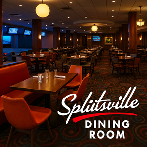 A father and his young daughter enjoy food and beverages at the Splitsville Dining Room